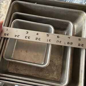 Four aluminum cake pans perfect for stacking for a small celebration cake